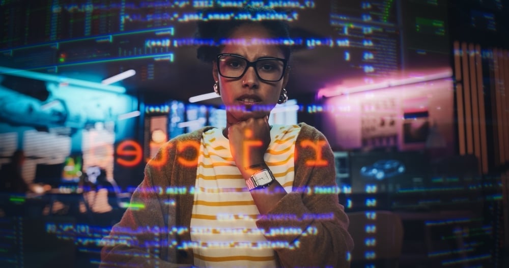 A female programmer looking at a transparent screen and seeing the word rejected.